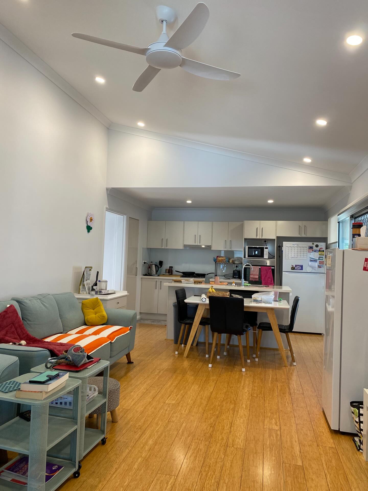 Vaulted ceiling open-plan kitchen and living repaint by Munn & Co. Finishes, painters in Tweed Heads