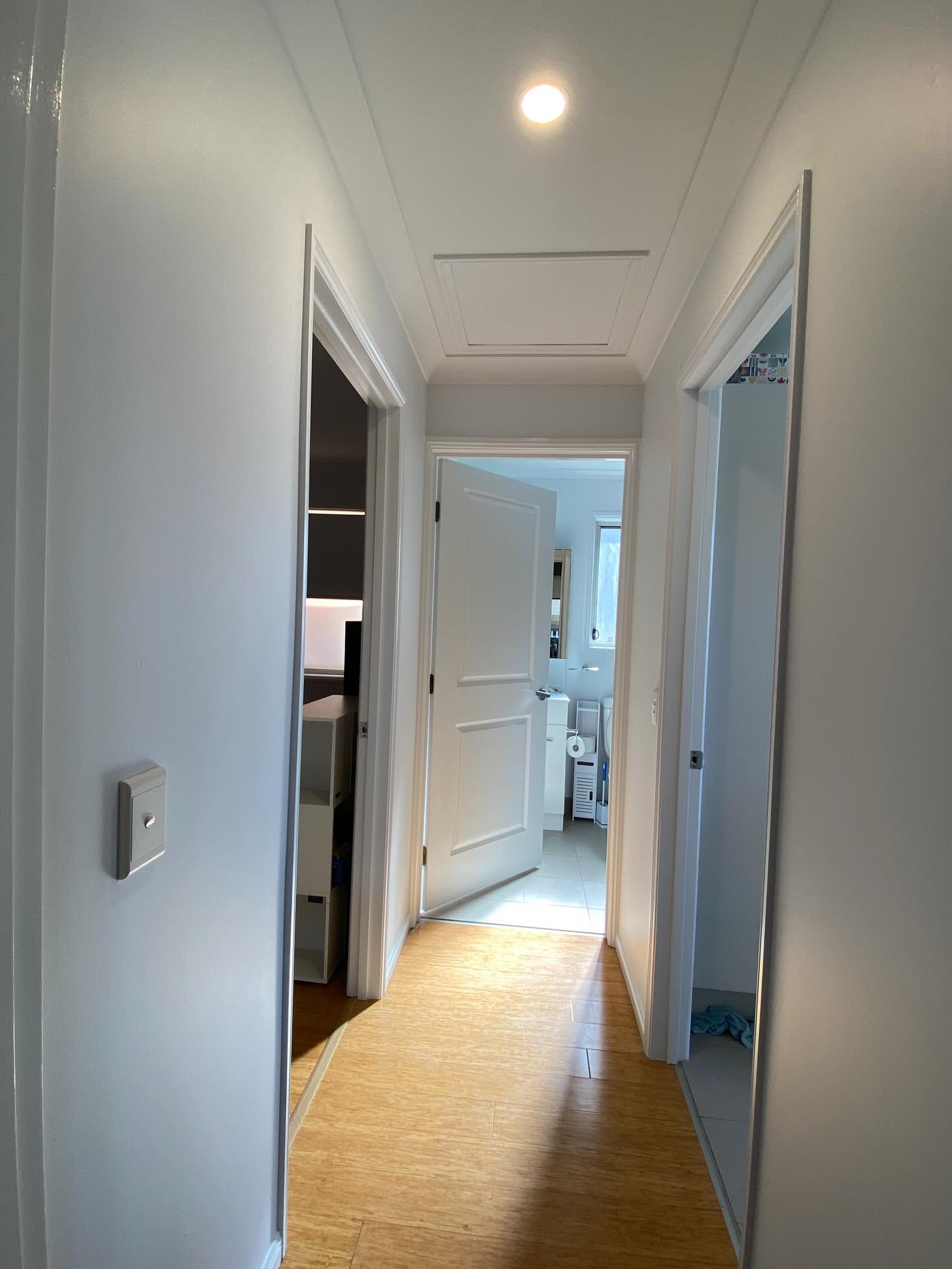 Crisp white hallway, ceiling and trim repaint by Munn & Co. Finishes in Tweed Heads