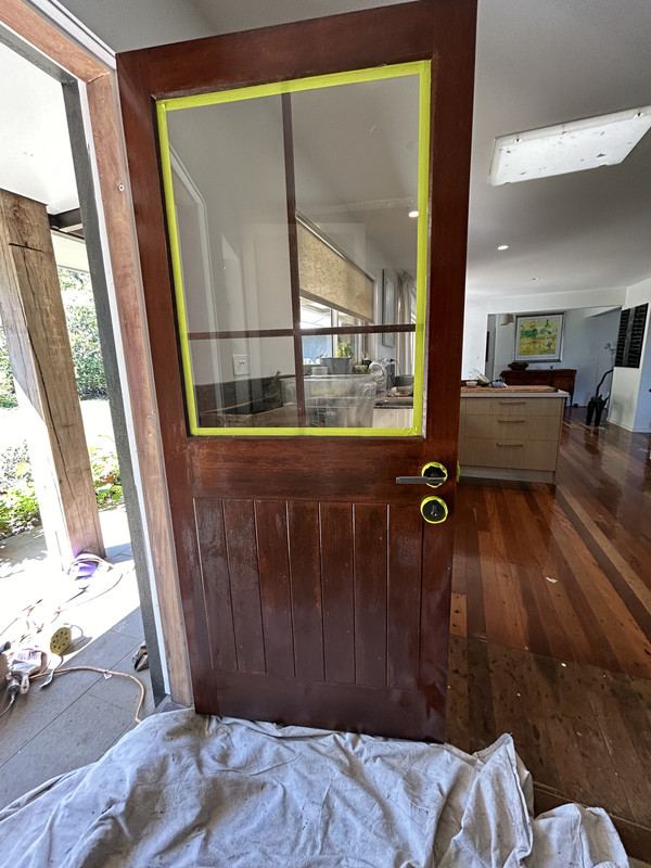 Stained timber doors refinished by Munn & Co. Finishes